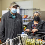Arturo and Theresa shop for food during an evening distribution at AWARE Food Bank in Woodburn.