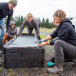 Marion Polk Food Share Farm & Gardens team members build a new set of raised-bed gardens at the Confederated Tribes of Grand Ronde.
