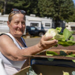 Maggie shops for fresh produce during an Iskam MәkhMәk-Haws mobile pantry distribution at an RV park near Willamina.