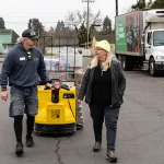 Marion Polk Food Share delivery driver Zimmer, left, talks with Judi, assistant manager of Keizer Community Food Bank.

Signed release.