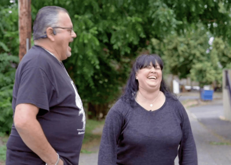 JR and Amy sharing a laugh at a pantry