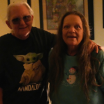 Kathy and her sister posing for the camera smiling